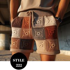 a man wearing shorts with crocheted squares on them