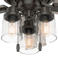 three light ceiling fixture with clear glass shades on the top, and two lights attached to the