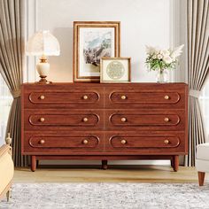 a wooden dresser sitting in front of a window