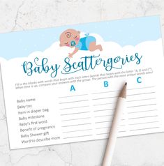 a baby shower game with a pencil on top of it and a notepad next to it