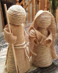 two burlap twine wrapped snowmen sitting on top of a marble table