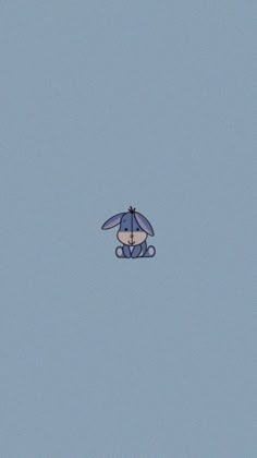 a blue kite flying in the sky with an umbrella on it's back end