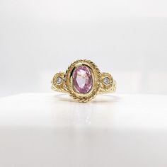 14k Solid White Gold 1/2CT Pink Sapphire & 1/6 TCW Diamonds Ring Size 6 *Item Details* All Round Diamonds SI Quality Ring Size 7 Ring Weight Approx. 3.9g Approx. Sapphire Carat Weight: 1.4 TCW Approx. Diamond Carat Weight: 0.03 TCW The ring has been refinished by a professional Jeweler to look brand new. All diamonds are natural, genuine, and have been tested. Black Felt Ring Box Included SOLD AS IS *Shipping Info* FREE SHIPPING A signature upon delivery is required Returns are accepted within 14 days of receiving the item, returned items have a 15% restocking fee. The item must be in the same condition and unaltered. Florida requires I collect 7% tax on transactions within Florida Yellow Gold Diamond Ring With Pink Sapphire Accents, Pink Sapphire Jewelry In Yellow Gold With Diamond Accents, Heirloom Pink Sapphire Ring In Yellow Gold, Heirloom Pink Sapphire Sapphire Ring In Yellow Gold, Heirloom Yellow Gold Pink Sapphire Ring, Heirloom Style Oval Pink Sapphire Jewelry, Heirloom Oval Pink Sapphire Jewelry, Gold Pink Sapphire Rings Fine Jewelry, Yellow Gold Jewelry With Pink Sapphire For Anniversary