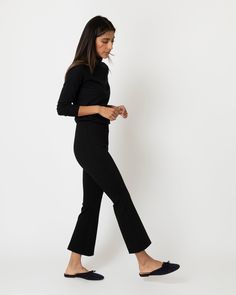 Minimal, clean, and quietly chic: our Faye shape is a refined pant without all the fuss. It just pulls on, with an elastic waist that doesn't scream “elastic waist” and a kick flare that's cropped to an above-the-ankle length. This particular pair is our go-to, made of a lush, stretchy ponte knit that holds you in a bit and feels really good against the skin. Add a sweater and a scarf for an instant plane (or anywhere else) outfit. Cropped Flare Dress Pants, Cropped Flare Pants Outfit, Ponte Pants Outfit, Black Flare Pants Outfit, Denim Sweater Jacket, Cropped Flare Pants, Ponte Pants, Clothing Catalog, Black Flare