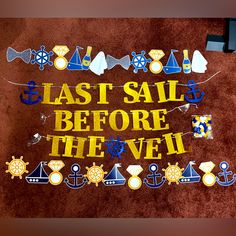 a sign that says last sail before the veil on top of a carpeted floor