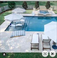 an outdoor swimming pool with lounge chairs and umbrellas next to the pool is shown