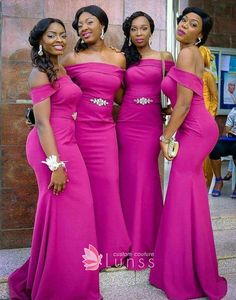 three women in pink dresses posing for the camera