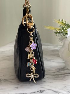 Studding My Purse, Elegant Dangle Charms, Luxury Logo Bag Charm, Luxury Bag Charm With Logo, Coach Aestethic Bags, Luxury Women's Logo Bag Charm, Luxury Designer Bag With Logo Charm, Handbag Picture Charms, Luxury Designer Bags With Logo Charm