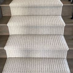 white carpeted stairs leading up to the top