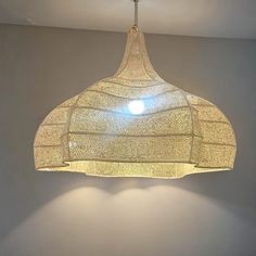 a light fixture hanging from the ceiling in a room