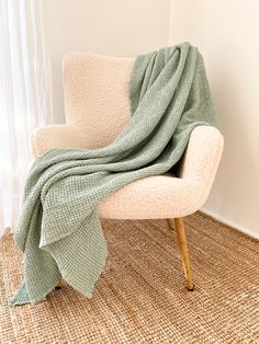 a chair with a blanket on top of it