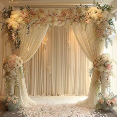 a decorated stage with flowers and petals on the floor