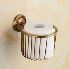 a toilet paper holder hanging on the wall