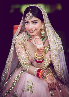 a woman in a pink bridal outfit