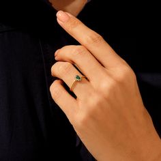 The Minimalist Emerald Oval Ring will demonstrate your taste in the best way so that you can feel yourself more stylish and special at any time of the day with the Minimalist Emerald Oval Ring, which takes all the attentions around you with its sparkling tiny stones and glamorous stance. - Made in 14k solid gold - Decorated with handset emerald coloured cubic zirconia stone on 14k solid gold - Band Width: 1.36 mm / 0.053 inches- Ring Width: 7.69x5.85 mm / 0.302 x 0.230 inches - Thickness: 1.20 m Green Engagement Ring, Floral Engagement Ring, Green Stone Rings, Emerald Color