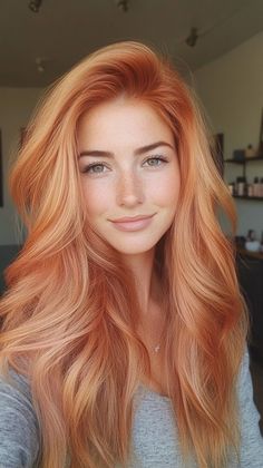 Stay on-trend with peachy copper waves that add a stylish edge to your look. Visit our site for more inspiration on how to achieve this fashionable transformation. Don’t forget to save this pin for your next salon visit! Peach Copper Hair, Blond Rose, Ginger Hair Color, Red To Blonde