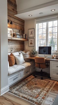 a home office with built in shelving and desk