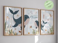 three framed art prints on the wall in a child's room with sea animals