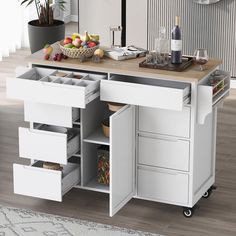 a kitchen island with drawers and wine bottles on it