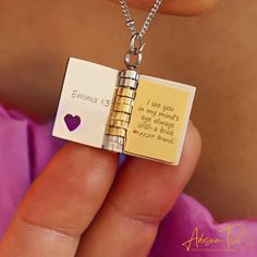 JEWELRY ∙ BOOK ∙ NECKLACE Our Book Locket Necklace is the perfect choice for a book lover! This beautiful piece of bookish jewelry is a locket necklace that can be personalized with up to 40 characters on one side (up to 3 sides), along with your name on the outside or inside of the cover. The pages in the book actually turn, making it a truly special and one-of-a-kind accessory. It's the perfect gift for any book lover, sister, friend, or loved one.  HOW ∙  TO ∙  ORDER Please enter the message you would like: - BOOK COVER: 20 Letters Max on book cover. - INSIDE PAGE: 40 Letters Max on each side of the page.  You can structure message like this: Book cover: (name/word of your choice) Page 1: (your message) Page 2: (your message) Page 3: (your message) Example:  Book cover: Michaella Page 1 Personalized Bookish Necklace For Gift, Book Necklaces, Mum Presents, Bookish Jewelry, Book Locket Necklace, Jewelry Book, Bff Jewelry, Message Necklace, Book Necklace