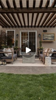 an outdoor living area with couches and tables