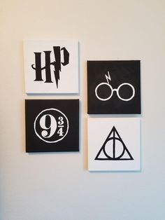 four harry potter stickers are hanging on the wall