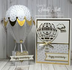 a white and gold birthday card with an air balloon