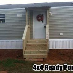 a house with stairs leading up to the front door