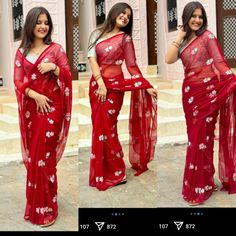 a woman in a red sari posing for the camera with her hands on her hips