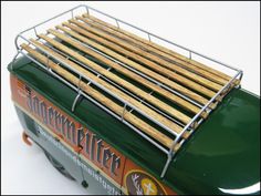 a close up of a toaster with wooden sticks in it