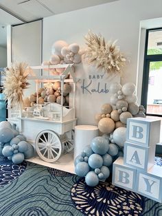 a baby shower is set up with balloons and decorations