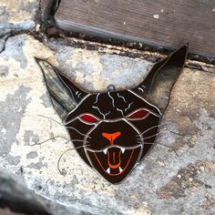 We are sure you will love this stained glass suncatcher! Such vampire cat is a perfect spooky ornament for Halloween celebrations :) Beyond any hesitations, your home will rock with such stained glass decor! Measurements: 5.25 x 5.5 inches In the process of stained glass goods creation, we refer to the L.C. Tiffany method of copper foil. When manufacturing this window hanging we used such high-quality materials, as: 3 mm Spectrum glass 3 mm Wissmach glass Tin Copper foil Black patina Wax Please, follow the instructions, and wipe stained glass products only with a wet cloth. Be sure that your order will be delivered in its entirety and good condition, as we will carefully pack it into a special brand box. ______________ If you want to get a CUSTOMISED stained glass masterpiece, please, feel Stained Glass Bat Pattern, Stained Glass Vampire Lips, Spooky Suncatchers, Stained Glass Halloween, Stained Glass Witch Suncatcher, Stained Glass Cat Suncatcher, Pic Candle, Cat Stain, Vampire Cat