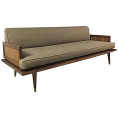 a couch that is sitting on top of a wooden frame