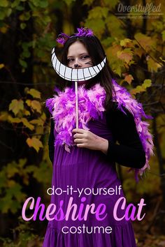 a woman in a purple dress holding a stick with the words do - it - yourself che