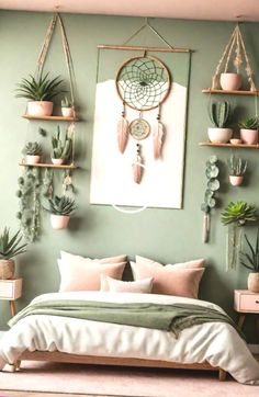 a bedroom with green walls and hanging plants on the wall above the bed, along with potted cacti