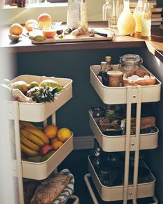 an open refrigerator with food and drinks on the shelves next to it, in a kitchen