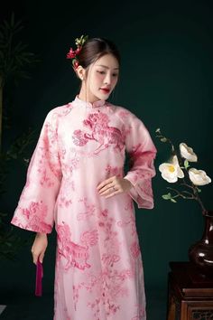 "🌿 This set includes traditional Ao Dai, red pants. Style: Traditional Material: Very well made with high-quality double layers Collar: traditional collar Please provide bust-waist-and hip measurements when placing your order to ensure the best fit for you. 🌿 NOTE: * Recommend gentle washing * Please contact us for any inquiries about size. We don't have an exchange policy for the wrong size * It is safe for a washer and dryer in a \"delicate\" setting. * Actual Ao Dai colors may differ up to 10% due to lightning and viewing devices. * These ao dai pants are made based on Vietnamese size; they will run smaller than American size. *3D printed ao dai: you may see some white broken fabric around the seam (collar). *There might be some chalk/ pen writings on the fabric because it is brand ne Bridesmaid Ao Dai, Ao Dai Red, Lace Ao Dai, Wedding Ao Dai, Vietnam Costume, Modern Ao Dai, Blouse Size Chart, Pants Style, Red Pants