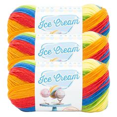 three skeins of ice cream yarn in multicolors on a white background