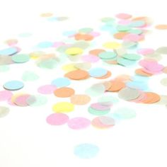 multicolored confetti scattered on white background