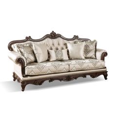 an ornately decorated couch with pillows on it's back and armrests