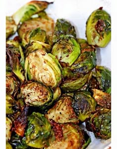 brussel sprouts on a white plate with brown speckles