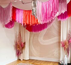 pink and red streamers hanging from the ceiling