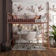 a loft bed with a desk underneath it and lots of birds on the wall behind it