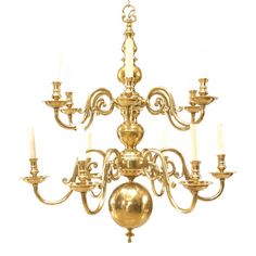 an antique brass chandelier with eight candles