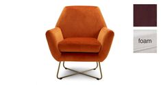 an orange chair sitting on top of a metal frame base with a white wall in the background