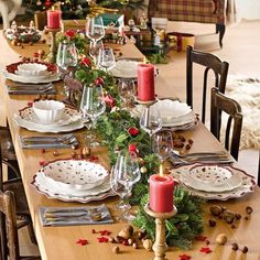 a dining room table set for christmas dinner