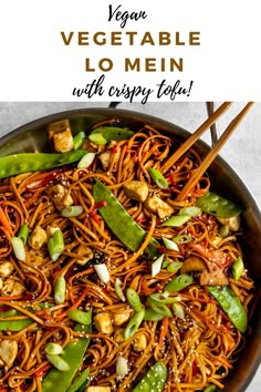 vegetable lo mein with chopsticks in a skillet on the side and text overlay that reads vegan vegetable lo mein