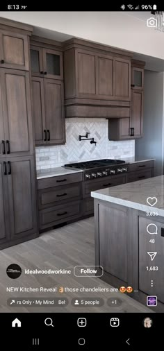 a kitchen with wooden cabinets and white marble counter tops is shown on the phone screen