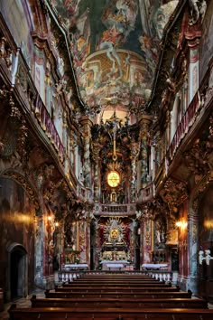 the interior of an old church with painted ceilings