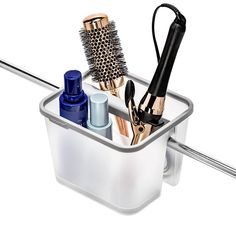 Clear up vanity space and safely store cooling hot tools with madesmart's® Hanging Hair Tools Organizer. The uniquely shaped organizer fits perfectly over towel bars and cabinet doors, or sits elegantly on the vanity providing a consolidated storage space for hair tools and other styling accessories. Heat-safe silicone lines compartments and edges providing grip and protection. Unplug hot styling tools before storing. Hair Tools Organizer, Curling Iron Storage, Vanity Space, Tools Organizer, Hair Tool Organizer, Iron Storage, Bathroom Baskets, Hair Tool, Bathroom Hardware Set